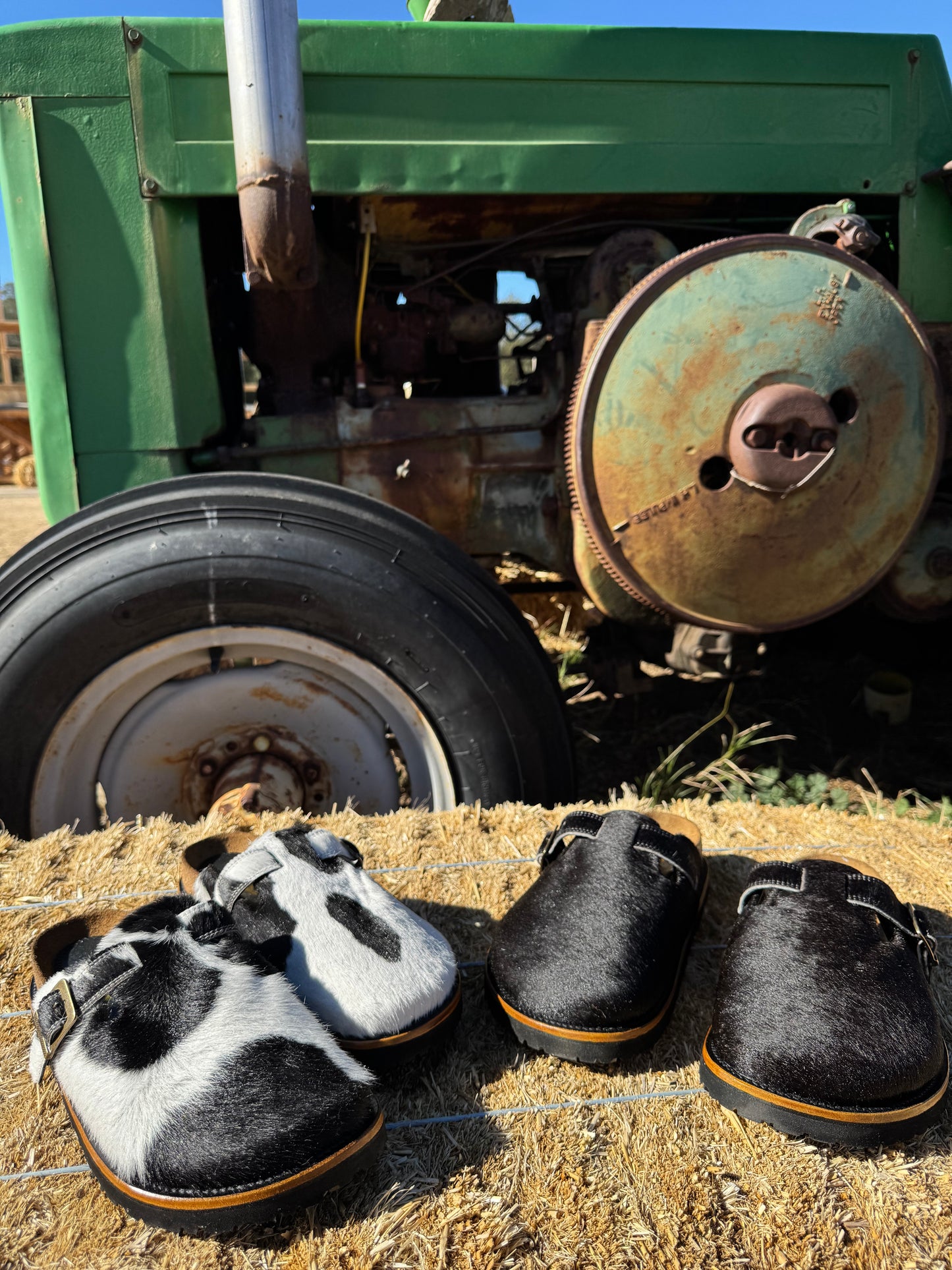 Black and White Cowhide Clogs