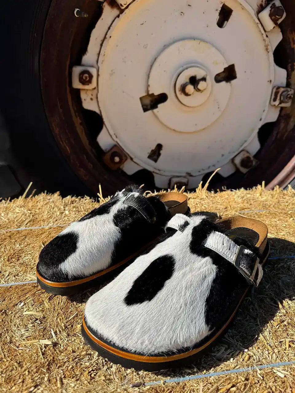 Botas Hasta La Muerte black and white cowhide clogs with cork footbed and Vibram sole handcrafted in León Mexico.