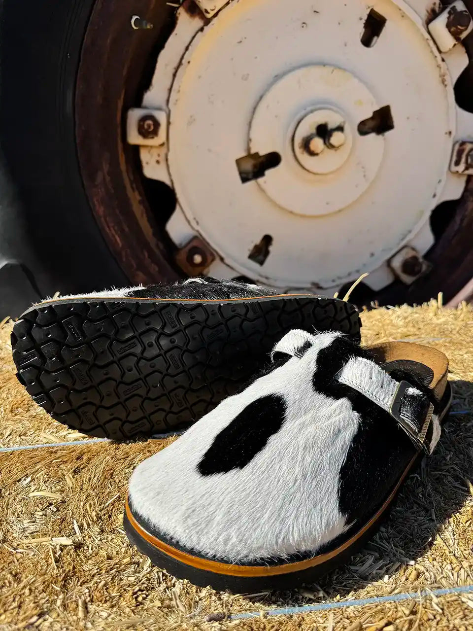 Botas Hasta La Muerte black and white cowhide clogs with cork footbed and Vibram sole handcrafted in León Mexico.