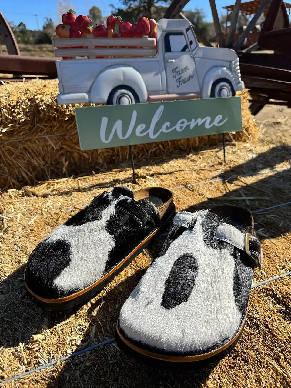 Botas Hasta La Muerte black and white cowhide clogs with cork footbed and Vibram sole handcrafted in León Mexico.