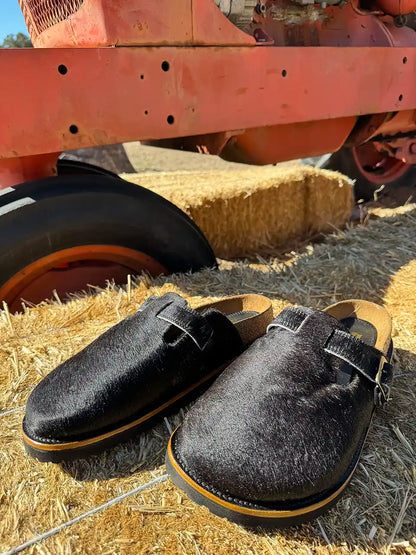 Botas Hasta La Muerte black cowhide clogs with cork footbed and Vibram sole handcrafted in León Mexico.