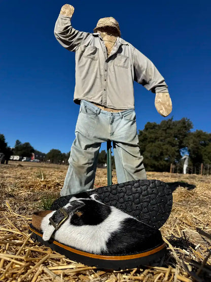 Botas Hasta La Muerte black and white cowhide clogs with cork footbed and Vibram sole handcrafted in León Mexico.
