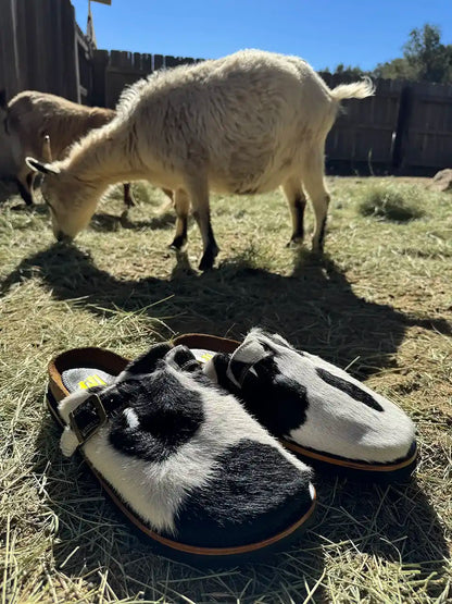 Botas Hasta La Muerte black and white cowhide clogs with cork footbed and Vibram sole handcrafted in León Mexico.