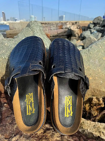 Botas Hasta La Muerte black alligator leather clogs with cork footbed and Vibram sole handcrafted in León Mexico.