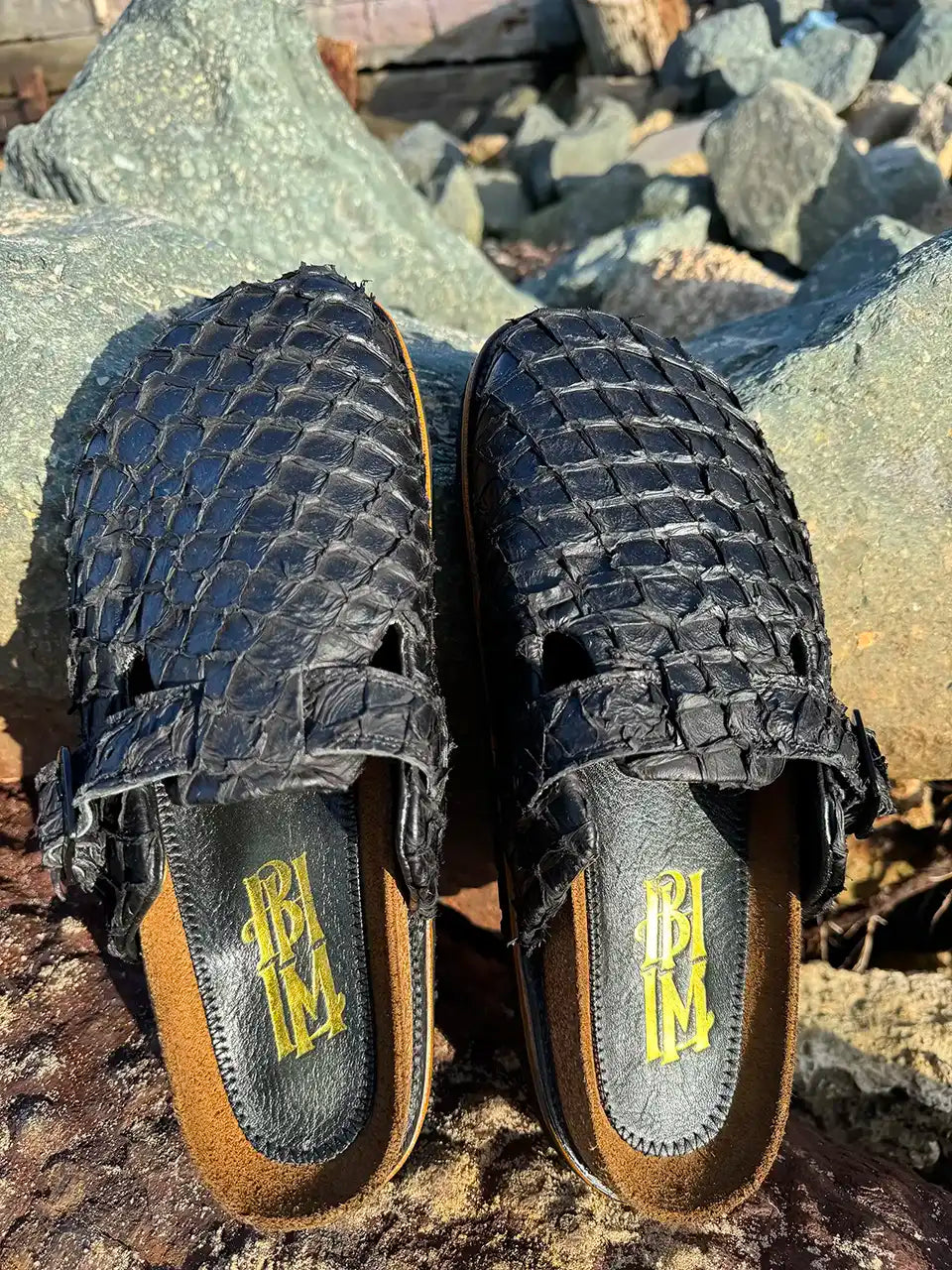 Botas Hasta La Muerte black pirarucu leather clogs with cork footbed and Vibram sole handcrafted in León Mexico.