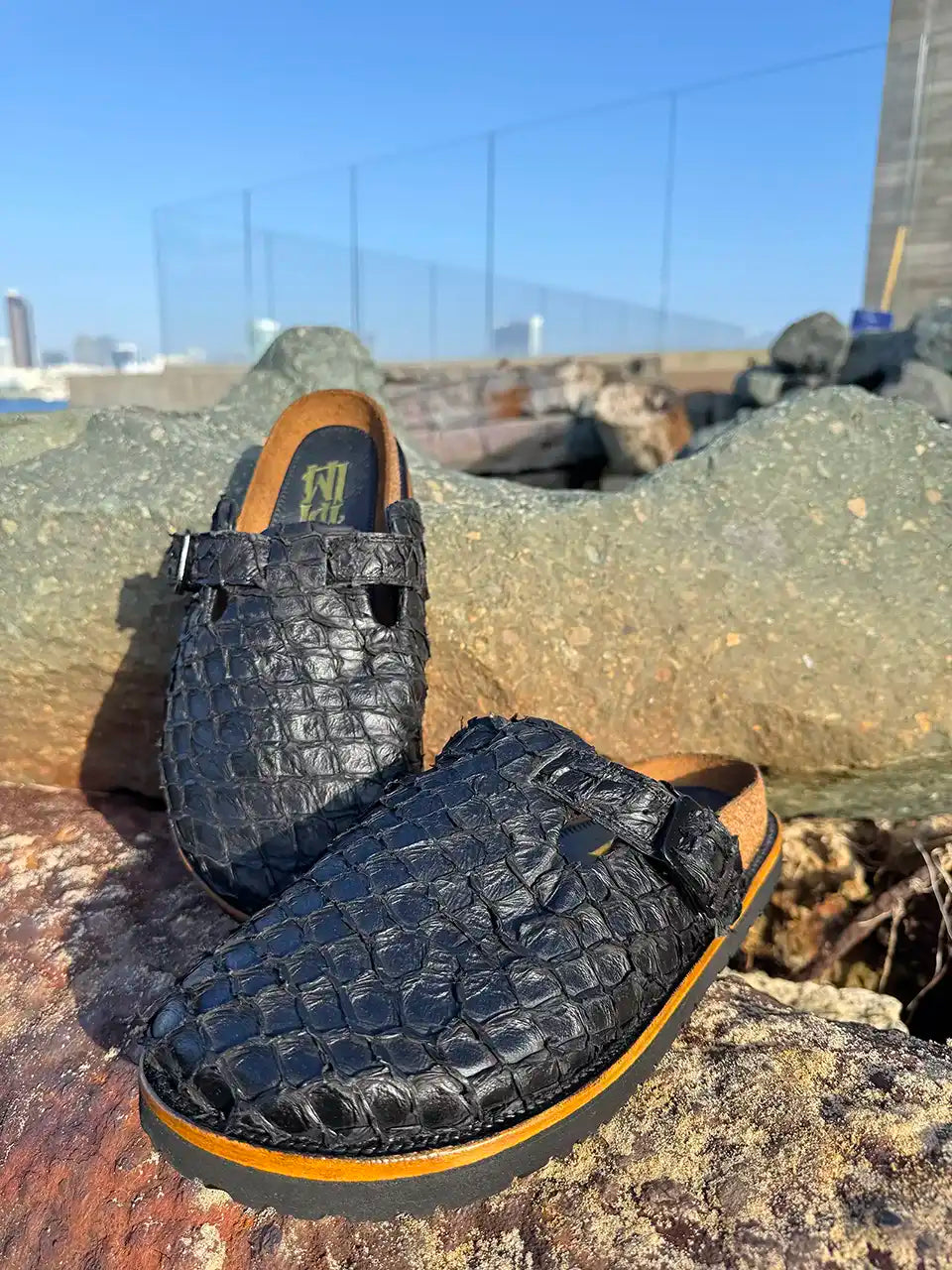 Botas Hasta La Muerte black pirarucu leather clogs with cork footbed and Vibram sole handcrafted in León Mexico.