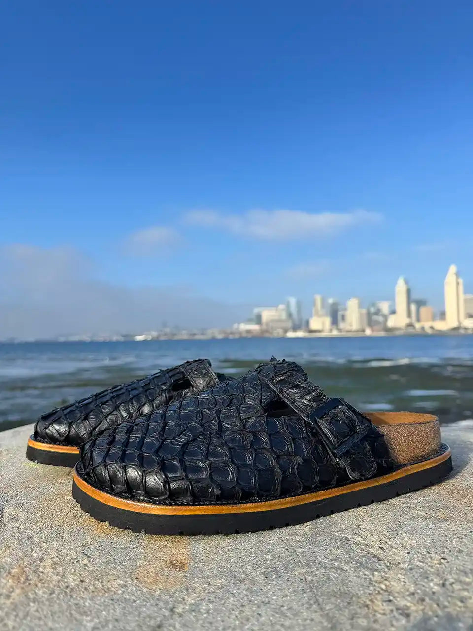 Botas Hasta La Muerte black pirarucu leather clogs with cork footbed and Vibram sole handcrafted in León Mexico.