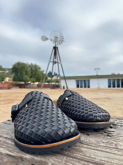 Botas Hasta La Muerte black Petatillo clogs with cork footbed and Vibram sole handcrafted in León Mexico.