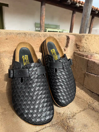 Botas Hasta La Muerte black Petatillo clogs with cork footbed and Vibram sole handcrafted in León Mexico.