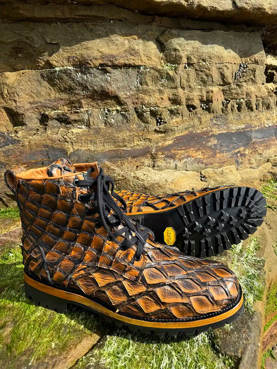 Botas Hasta La Muerte brown pirarucu leather lace up boots with Goodyear welt and lug soles handcrafted in León Mexico.