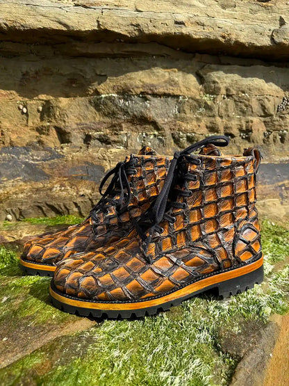 Botas Hasta La Muerte brown pirarucu leather lace up boots with Goodyear welt and lug soles handcrafted in León Mexico.