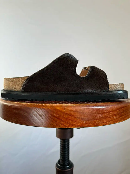 Botas Hasta La Muerte black cowhide huaraches with cork footbed and Vibram sole handcrafted in León Mexico.