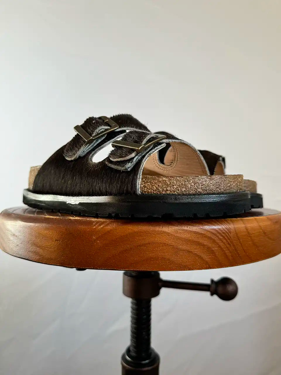 Botas Hasta La Muerte black cowhide huaraches with cork footbed and Vibram sole handcrafted in León Mexico.