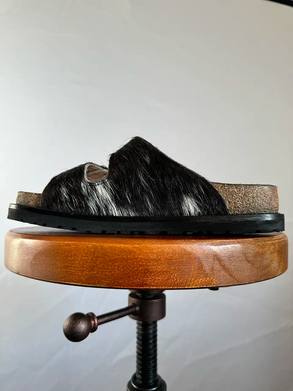 Botas Hasta La Muerte black and white cowhide huaraches with cork footbed and Vibram sole handcrafted in León Mexico.