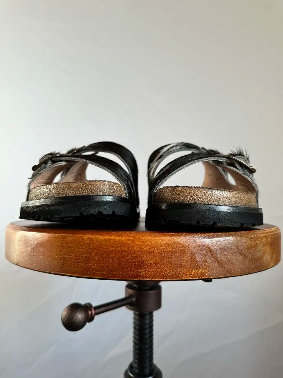 Botas Hasta La Muerte black and white cowhide huaraches with cork footbed and Vibram sole handcrafted in León Mexico.