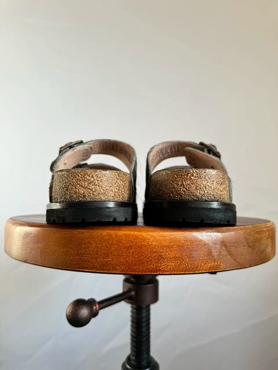 Botas Hasta La Muerte black and white cowhide huaraches with cork footbed and Vibram sole handcrafted in León Mexico.