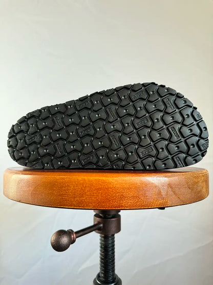 Botas Hasta La Muerte black and white cowhide huaraches with cork footbed and Vibram sole handcrafted in León Mexico.