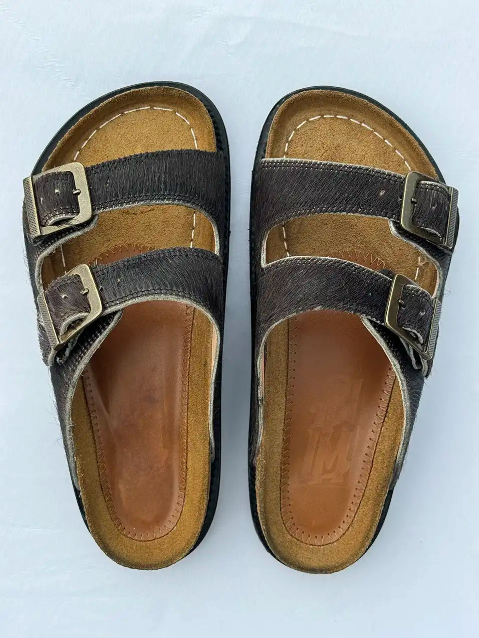 Botas Hasta La Muerte black cowhide huaraches with cork footbed and Vibram sole handcrafted in León Mexico.