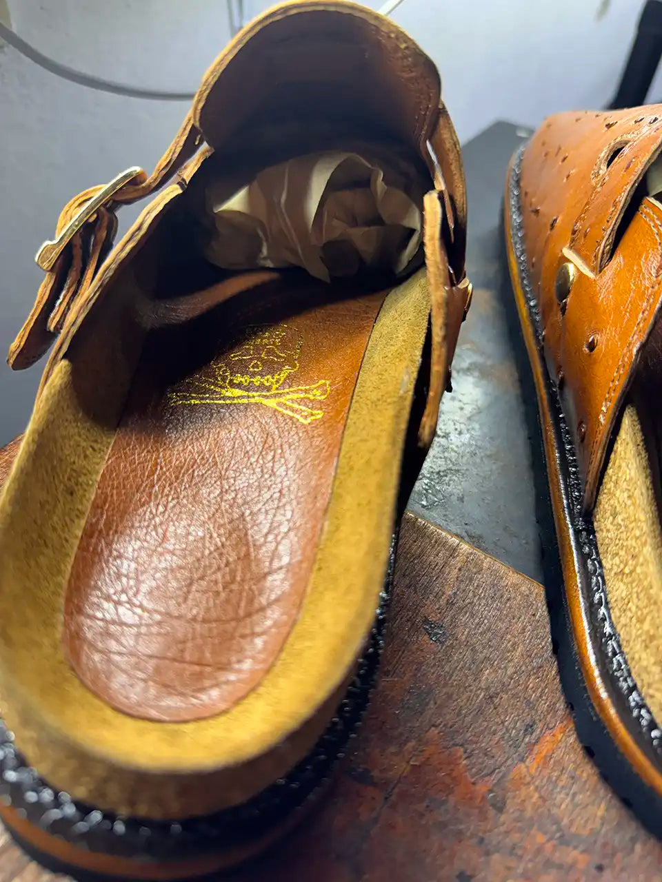 Botas Hasta La Muerte cognac brown full quill ostrich leather clogs with cork footbed and Vibram soles handcrafted in León Mexico.