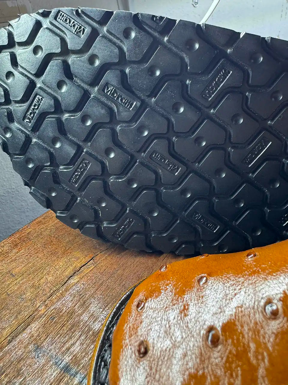 Botas Hasta La Muerte cognac brown full quill ostrich leather clogs with cork footbed and Vibram soles handcrafted in León Mexico.