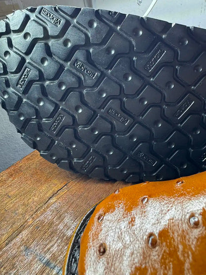 Botas Hasta La Muerte cognac brown full quill ostrich leather clogs with cork footbed and Vibram soles handcrafted in León Mexico.