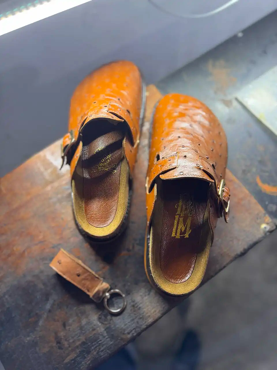 Botas Hasta La Muerte cognac brown full quill ostrich leather clogs with cork footbed and Vibram soles handcrafted in León Mexico.