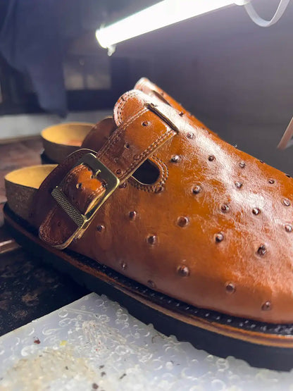 Botas Hasta La Muerte cognac brown full quill ostrich leather clogs with cork footbed and Vibram soles handcrafted in León Mexico.