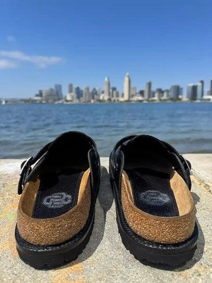 Black shark leather clogs with cork footbed and Vibram sole handcrafted in León Mexico. Botas Hasta La Muerte