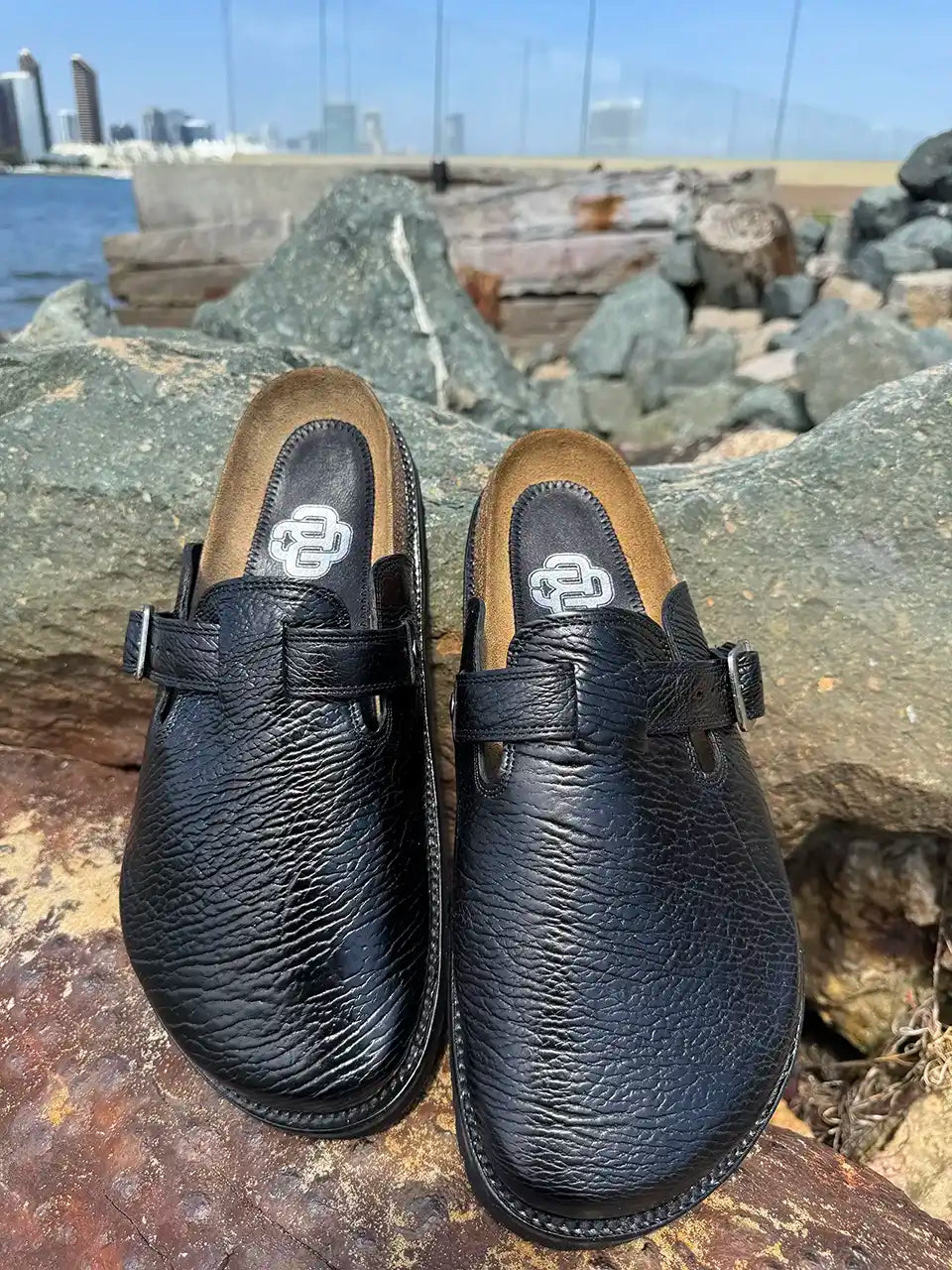 Black shark leather clogs with cork footbed and Vibram sole handcrafted in León Mexico. Botas Hasta La Muerte