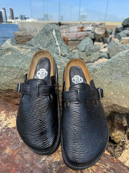 Black shark leather clogs with cork footbed and Vibram sole handcrafted in León Mexico. Botas Hasta La Muerte