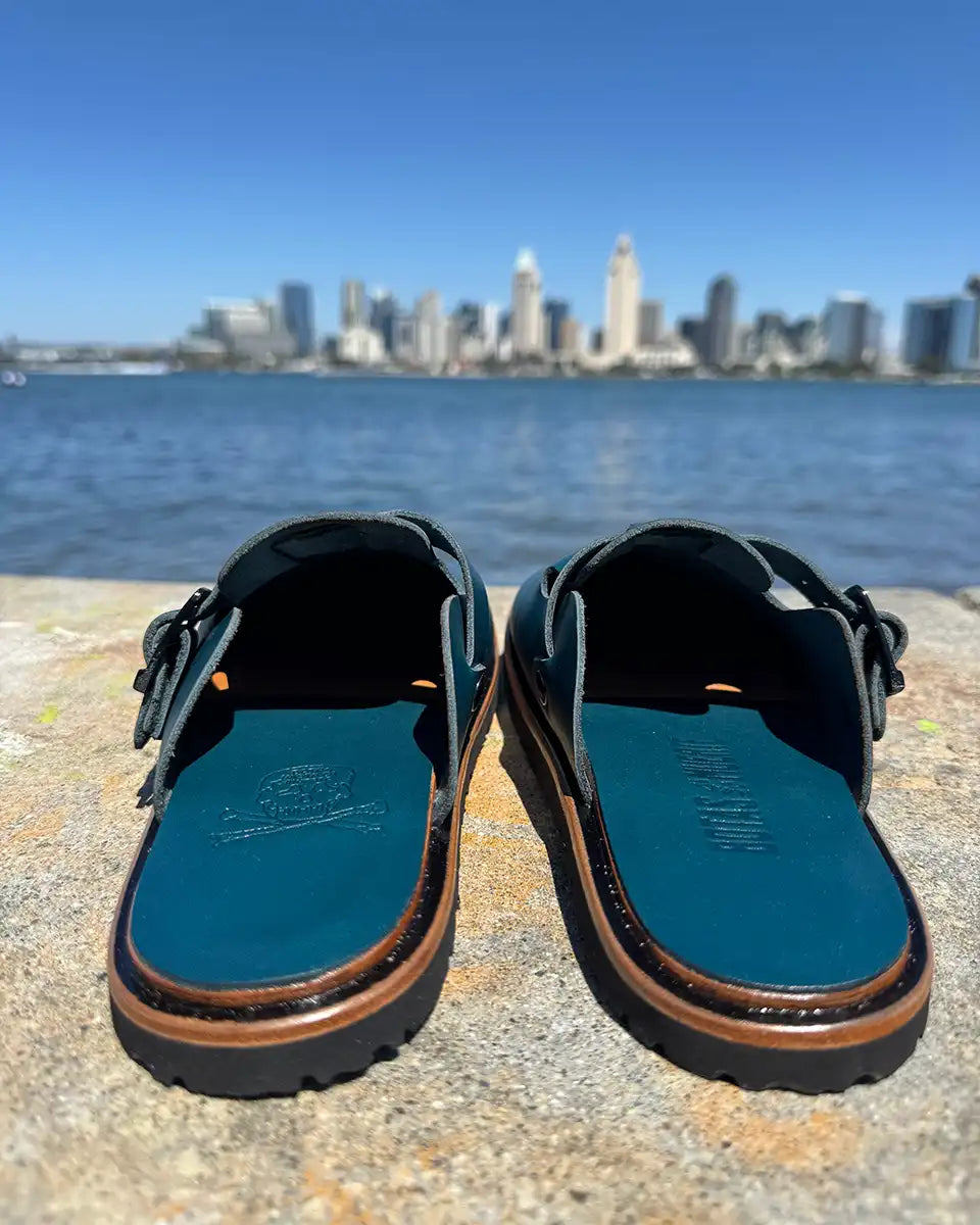 Botas Hasta La Muerte teal vegetable tanned zero drop clogs with Vibram rubber soles handcrafted in León Mexico.