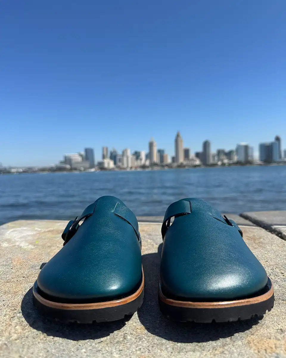 Botas Hasta La Muerte teal vegetable tanned zero drop clogs with Vibram rubber soles handcrafted in León Mexico.