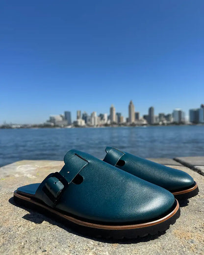 Botas Hasta La Muerte teal vegetable tanned zero drop clogs with Vibram rubber soles handcrafted in León Mexico.