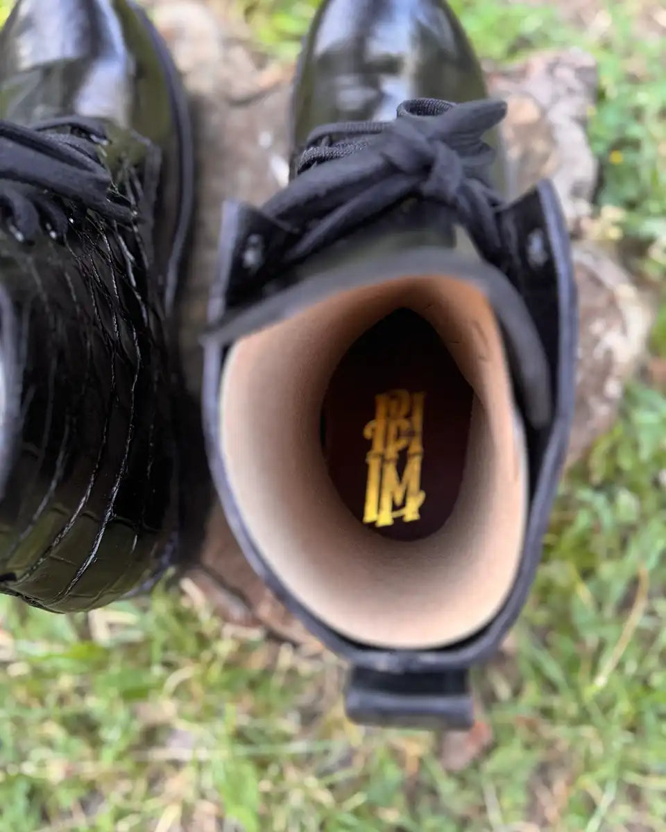 Botas Hasta La Muerte two panel alligator lace up boots with pull up leather vamps and Vibram lug soles handcrafted in León Mexico.