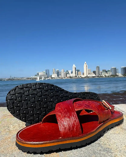 Botas Hasta La Muerte Cross Strap Huaraches in burnt red ostrich leather with Vibram soles handcrafted in León Mexico.
