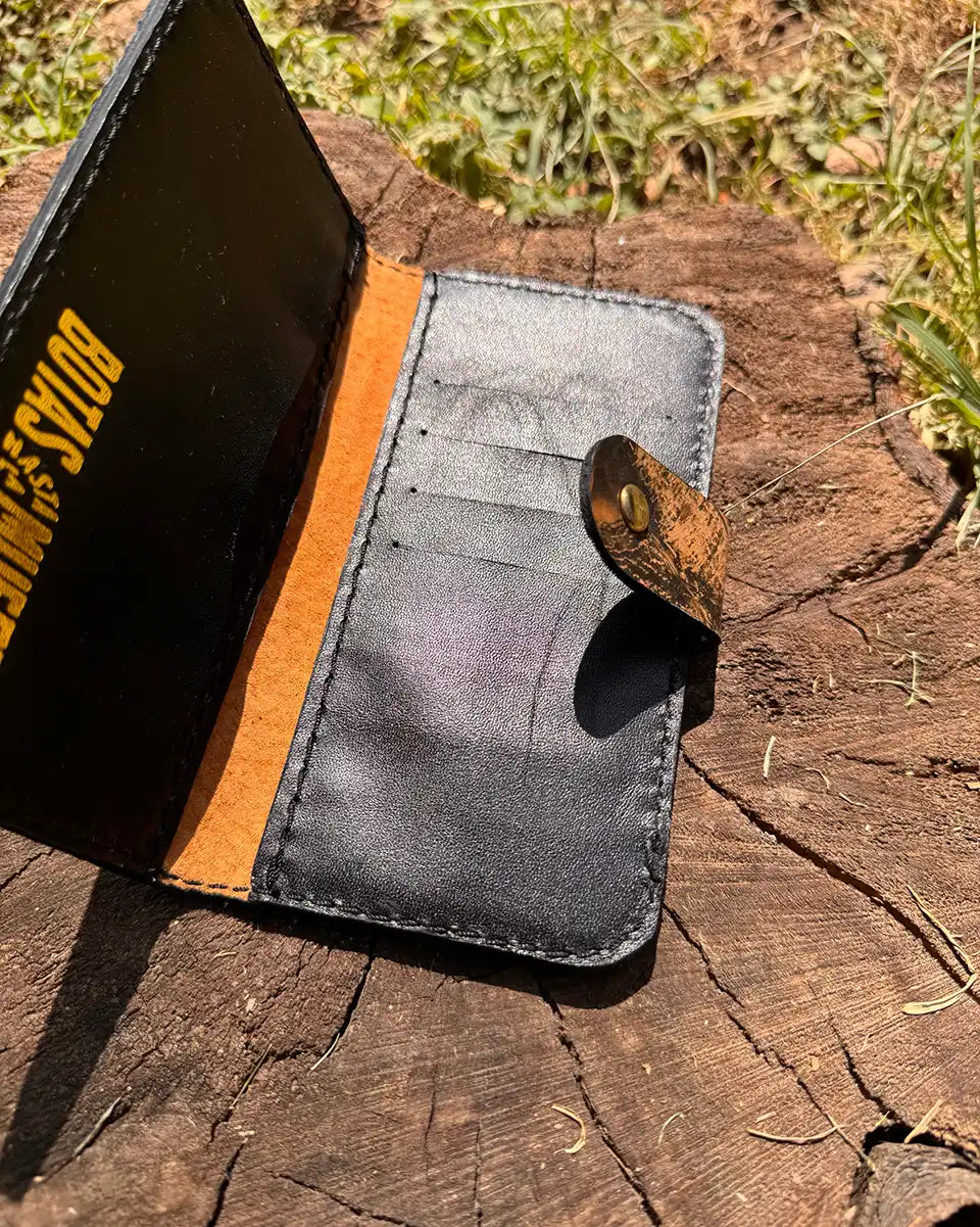 Botas Hasta La Muerte camouflage cowhide leather trucker wallet with brass snap closure handcrafted in León Mexico.