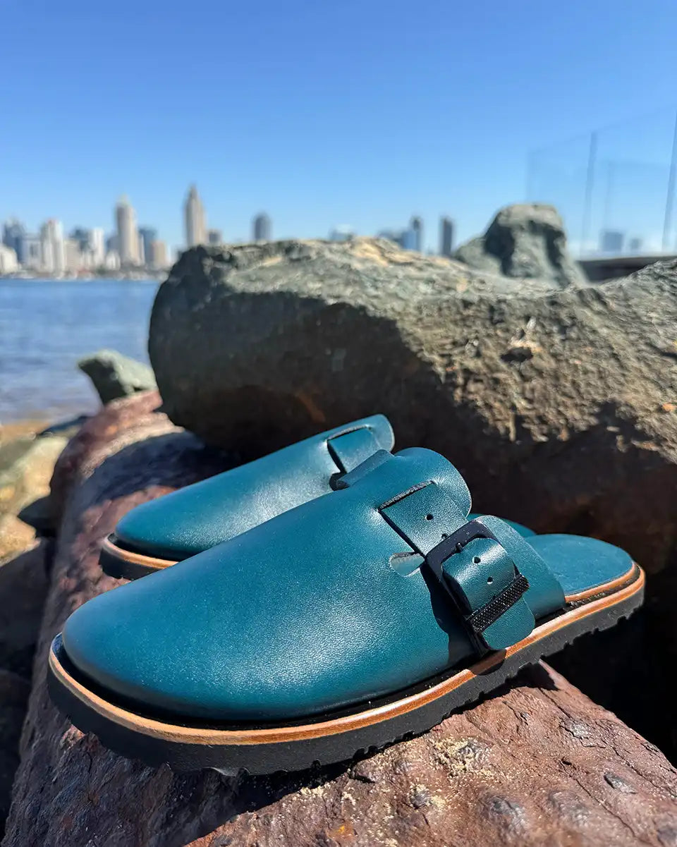 Botas Hasta La Muerte teal vegetable tanned zero drop clogs with Vibram rubber soles handcrafted in León Mexico.